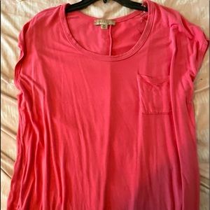 Super cute pocket tee with buttons down the back